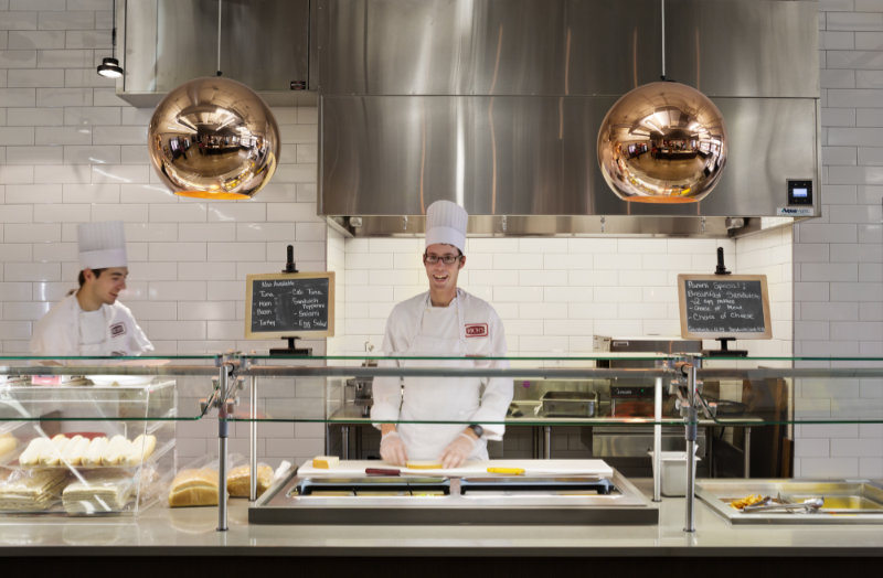 two chefs in the kitchen cooking