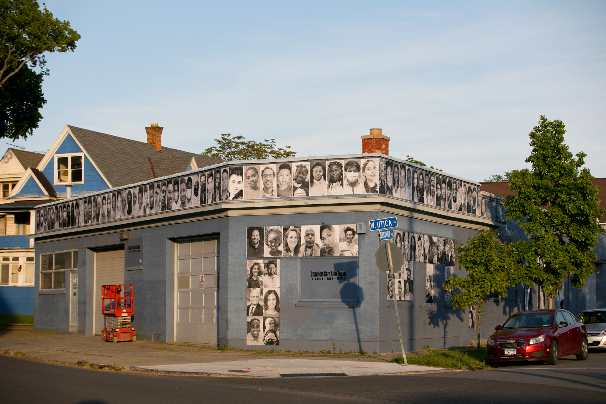 building with people's portraits lining the entire building